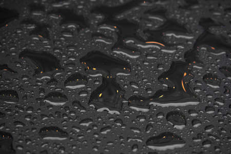 Close up water drops on metal surface can be used for web design. Abstract texture background