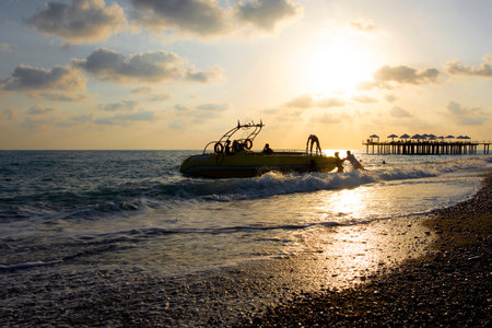 Orensehir, Turkey - August 30,2021: Silhouettes of people going on a boat trip at sunset in Turkeyのeditorial素材