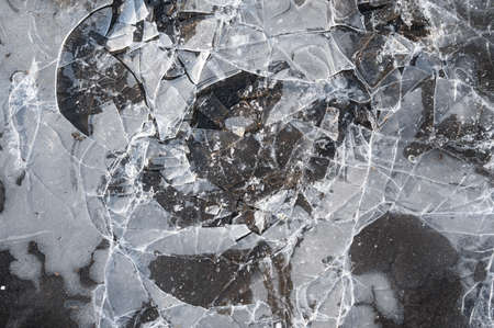 Cracked ice texture. Top view. Broken ice on the ground