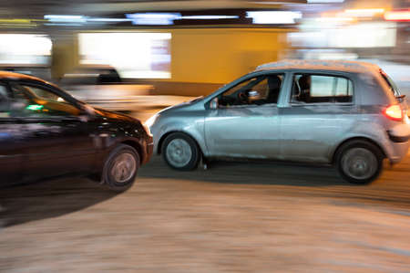Car accident. Two cars crashed on the city road. Intentional motion blur. Defocused image