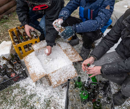 UZHHOROD, UKRAINE - MARCH 1, 2022: War of Russia against Ukraine. Volunteers making Molotov...