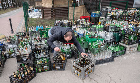 UZHHOROD, UKRAINE - MARCH 1, 2022: War of Russia against Ukraine. Volunteers making Molotov...