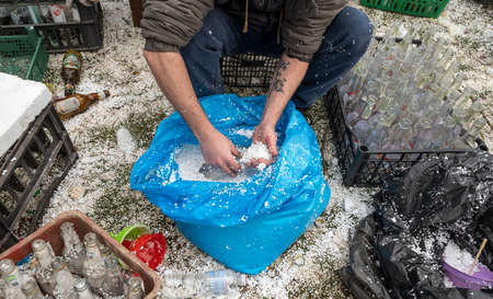 UZHHOROD, UKRAINE - MARCH 1, 2022: War of Russia against Ukraine. Volunteers making Molotov cocktailsのeditorial素材