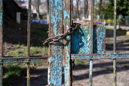 Old chain on the gate of the houseの写真素材