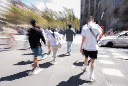 Busy city people going along the street. Intentional motion blur. Defocused imageの写真素材
