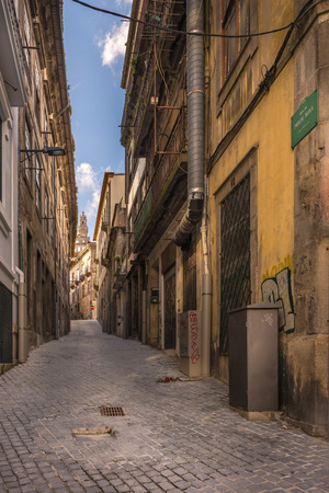 View of facades, alleyway and traditional houses in Ribeira old and historic town and alongside Douro River, Porto, Portugalのeditorial素材