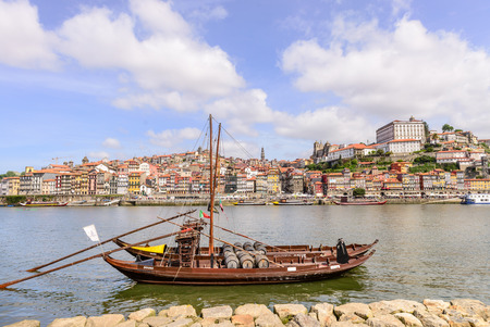 PORTO, PORTUGAL, APRIL 27, 2014: City of Porto seen from Vila Nova de Gaia with the traditional boats with wine barrels - Porto, Portugalのeditorial素材