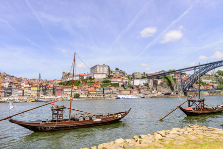 PORTO, PORTUGAL, APRIL 27, 2014: City of Porto seen from Vila Nova de Gaia with the traditional boats with wine barrels - Porto, Portugalのeditorial素材