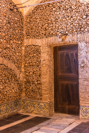 EVORA, PORTUGAL -APRIL 30, 2014: Chapel of the Bones in Evora with human bones and skulls in the wall - Alentejo, Portugalのeditorial素材