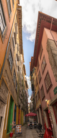 PORTO, PORTUGAL, APRIL 26, 2014: View of facades, alleyway and traditional houses in Ribeira old and historic town and alongside Douro River, Porto, Portugalのeditorial素材
