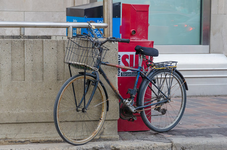 Toronto, Canada - 27 may 2013: Bicycle parked on the street in Toronto, Canadaのeditorial素材