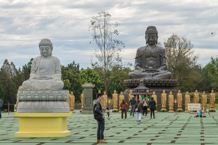 Foz do Iguazu, Brazil - july 8, 2016: Chinese classical Buddah and stone lions in a Temple at the Foz do Iguazu, Brazilのeditorial素材