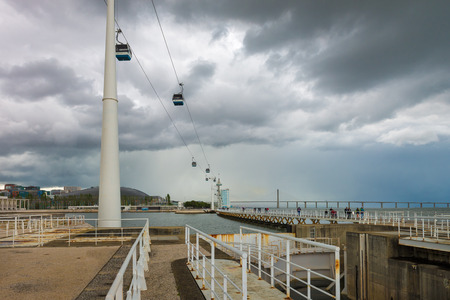 Lisbon, Portugal - April 20, 2014: Cable cars ( Telecabine Lisboa) overlook the Vasco da Gama bridge on the Tagus river from the Parque das Nacoes (Park of Nations) in Lisbon, Portugalのeditorial素材