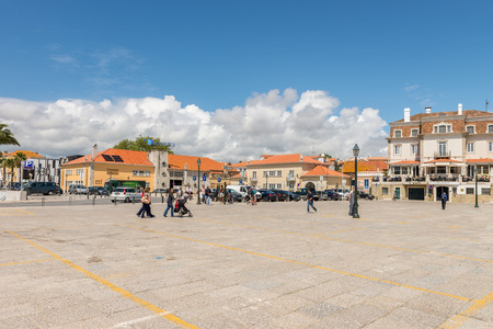 Cascais, Portugal - April 22, 2014: Tourist taking pictures near the beach at the Bay of Cascais, a portuguese coastal town 30 km west of Lisbon, Portugalのeditorial素材