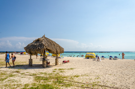Aruba, Caribbean - September 26, 2012: View of Tourists enjoying  Baby beach on Aruba island in the Caribbean seaのeditorial素材