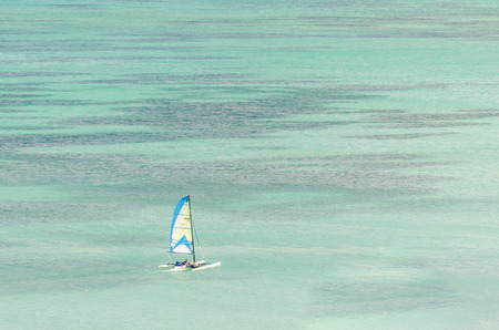 Aruba, Caribbean - September 26, 2012: Sail yachts in a blue caribbean sea in Aruba Islandのeditorial素材