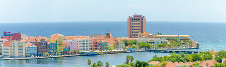 Curacao, Caribbean - September 29, 2012: Panorama view of  Willemstad  downtown with colorful facades in Handelskade Curacao, Netherlands Antillesのeditorial素材