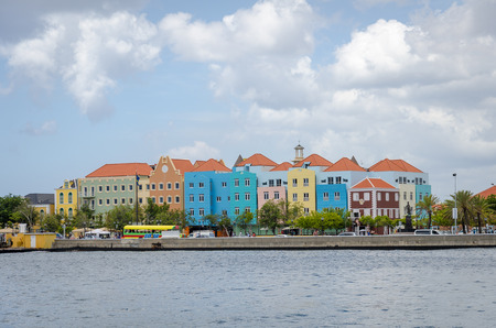 Curacao, Caribbean - October 2, 2012: Willemstad daylight in Curacao. Handelskade with colorful building facadesのeditorial素材