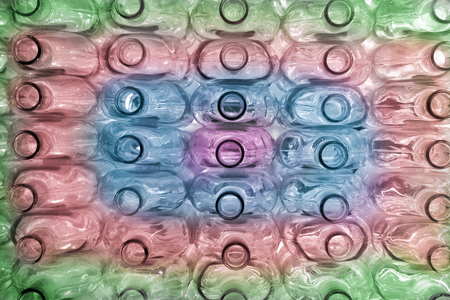 Large group of empty colored recycled glass bottlesの写真素材
