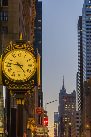 New York, USA - December 4, 2011: Trump Tower Clock and the Empire State Building at the evening...