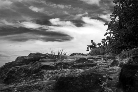 Itacare, Brazil - December 6, 2016: Surfer watching the waves at the amazing wild coastline in Itacare Brazilのeditorial素材