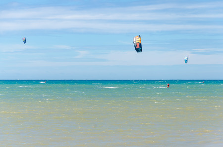Cumbuco, Brazil, jul 9, 2017: Panoramic view with lots of people doing kitesurfing on the beach of Cumbucoのeditorial素材