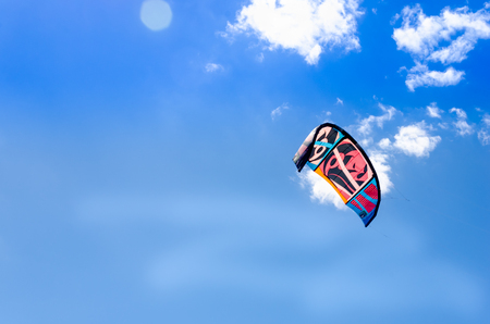 Cumbuco, Brazil, jul 9, 2017: Closeup of kite surf boarding flying over the sunny and bright blue skyのeditorial素材