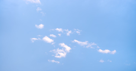 Nice cloud shapes on the bue bright sky as background