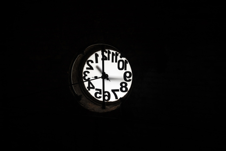 Big old clock embeded at the brick wallの写真素材