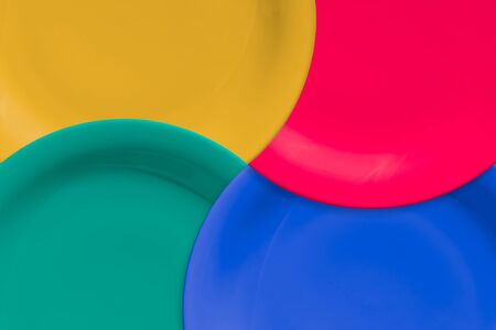 Carousel of empty and colorful plates. Clockwise Wavesの写真素材