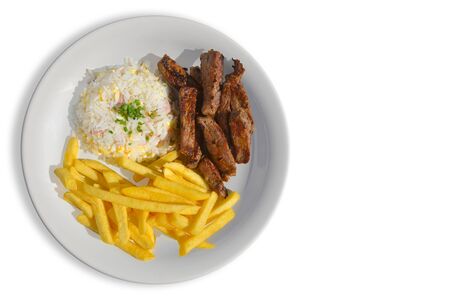 Tasty sliced steak garnished with rice and fries. White isolated backgroundの写真素材