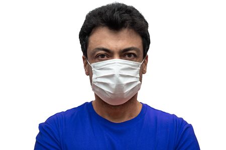 Man dressing a mask to protect other people from illness contamination or for personal protection. White isolated background.の写真素材
