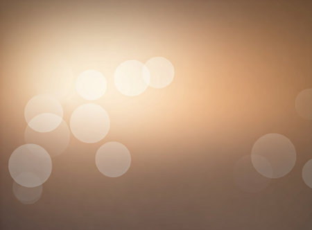 Elegant golden bokeh abstract background. Delicate blurred wallpaper texture. Template with defocused bokeh lights and copy space for business website design. Social media advertising banner.の素材