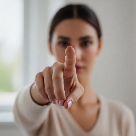 Woman Pointing Directly Toward Camera, Emphasizing Urgency, Command, Attention, and Direct Communication Through a Clear and Assertive Gestureの素材