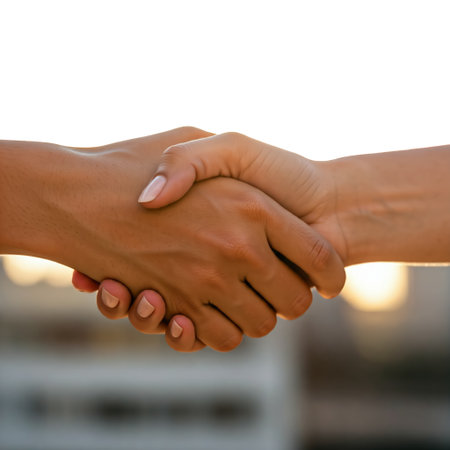 shaking hand on white isolated background.Athletes shaking hands before sports competition. Unity and teamwork concept. Family or friends.の素材
