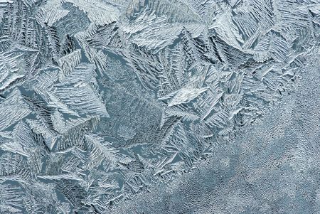 Hoarfrost on glass, texture of ice in thee cold winter.の写真素材