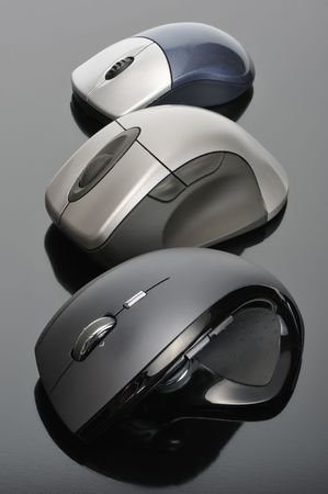 Modern wireless computer mouses on black backgroundの写真素材