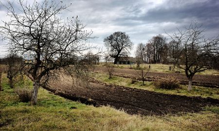 Village in the autumn, the house and plowed field の写真素材