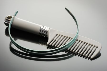 Grey comb and headband on a black backgroundの写真素材