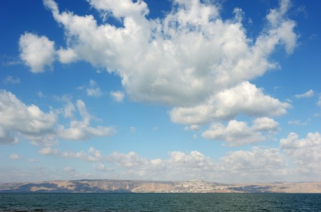 Sea of Galilee in the early morning, ripples on the water and clouds in the skyの写真素材