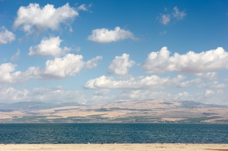 Sea of Galilee in the early morning, ripples on the water and clouds in the skyの写真素材
