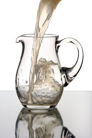 Glass pitcher, isolated on a white background.の写真素材