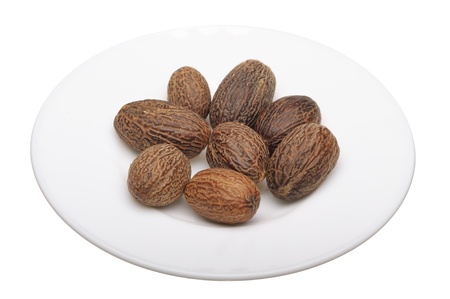 Whole nutmeg on a white background, isolatedの写真素材