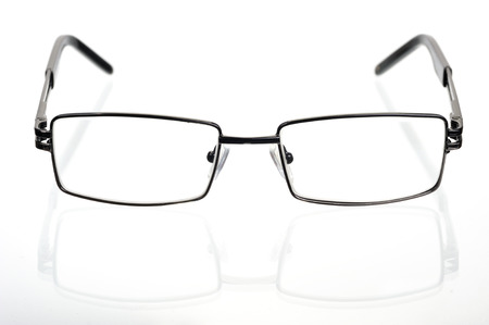 Rectangular glasses in a thin metal frame on a white background の写真素材