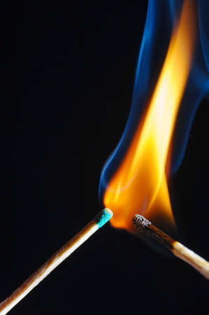 Wooden match, lights up, burns and goes out, on a black backgroundの写真素材