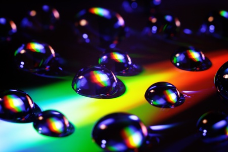 Abstract background. Varicolored dripped water.の写真素材