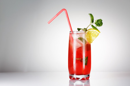 Singapore Sling cocktail with mint on gradient backgroundの写真素材