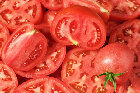 Sliced tomatoes background.の写真素材