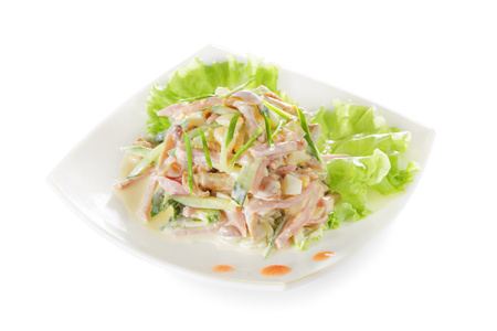 Vegetable salad with ham and mushrooms. Isolated on white background.の写真素材