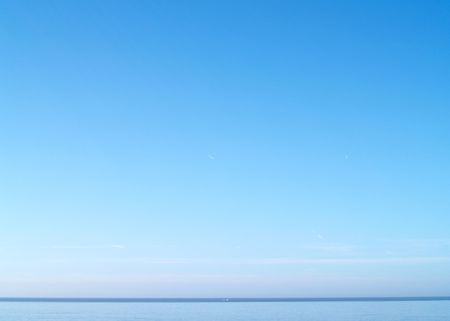Coastal waters with distant boatの写真素材
